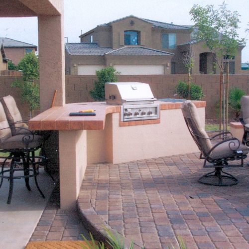 Outdoor barbeques and tables.