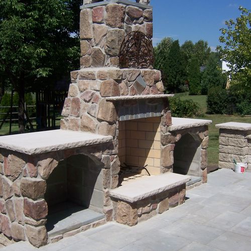 Stylish cultured stone wood fireplace that complim