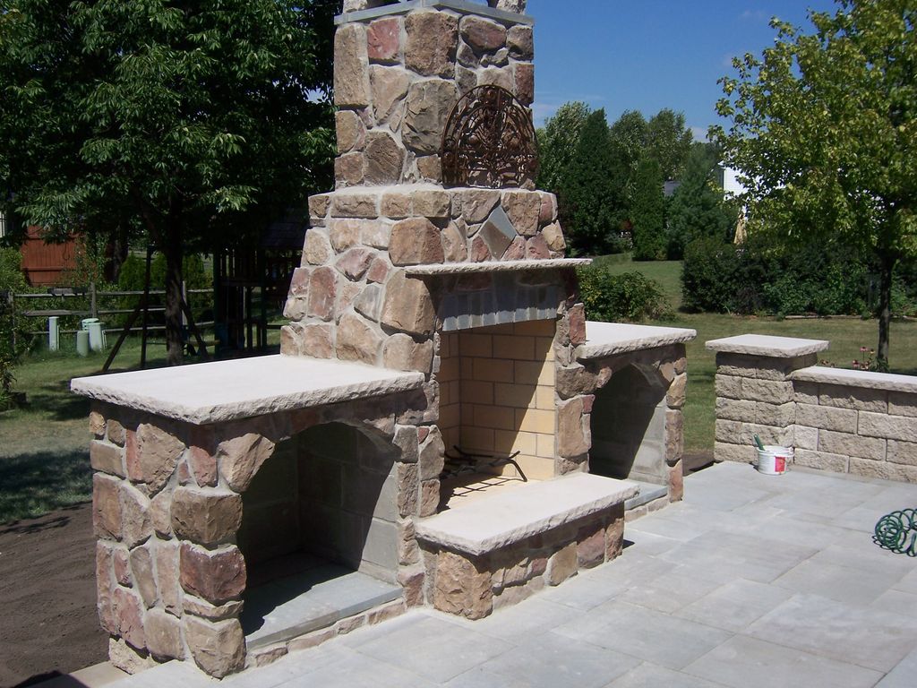Stylish cultured stone wood fireplace that complim