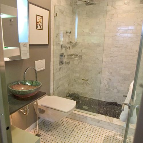 AFTER: replaced tub with walk-in shower, walls of 