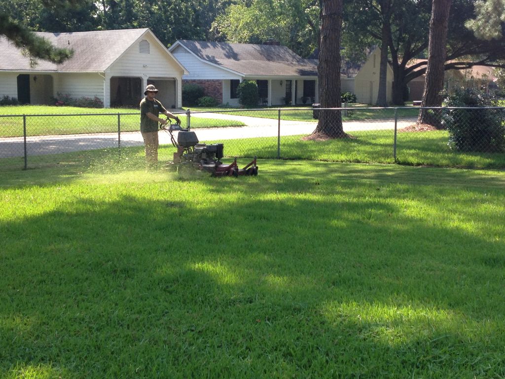 Performing lawn management services to property. (