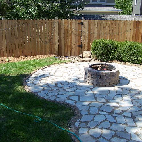With reclaimed Patio and Firepit, Fresh Sod and Fl