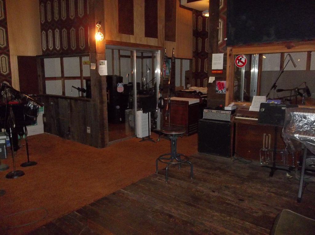 Studio A spacious recording room with singer and d