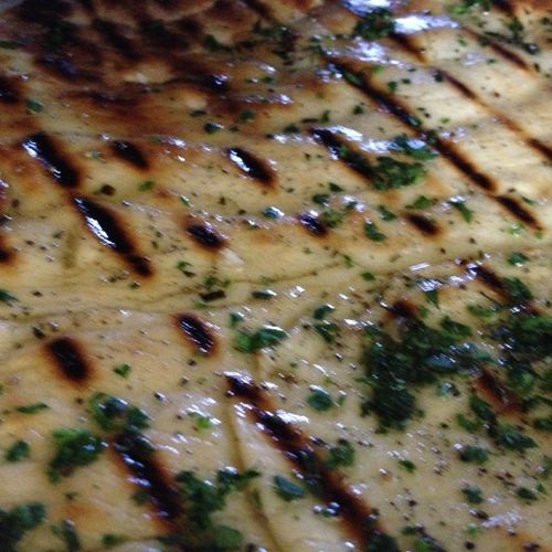 Grilled Naan with cilantro and red pepper flake