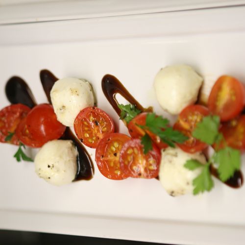 Caprese Salad with a fig balsamic reduction.