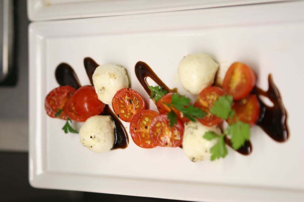 Caprese Salad with a fig balsamic reduction.