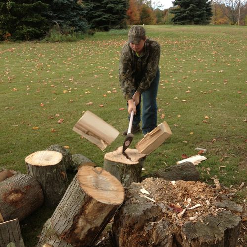 Splitting wood the old fashioned way. Not only do 