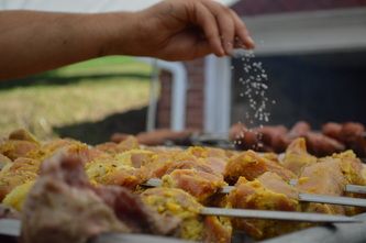 Salting the meat as it cooks