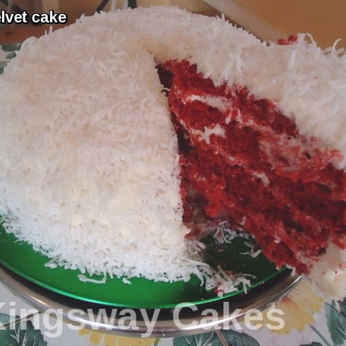 Red velvet cake covered in coconut shreds.