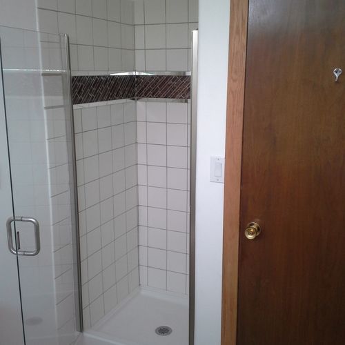 Custom tile shower in small bathroom renovation.