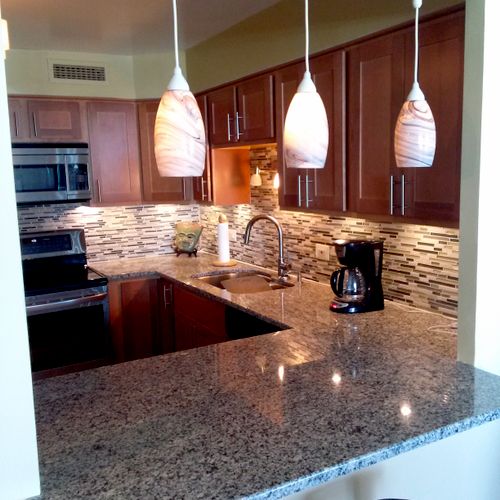 Condo kitchen with pendant lighting