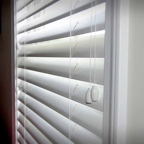 Shutter style wood blinds add elegance to any room