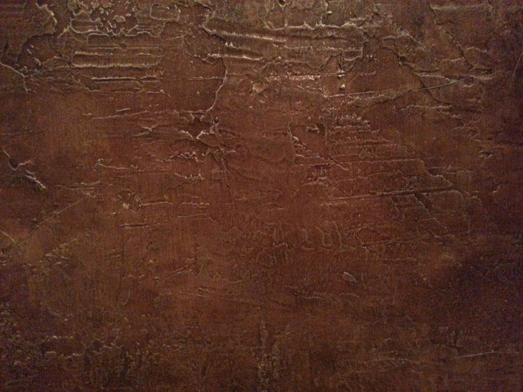 DETAIL: Wall texture, brown glazes, shiny gold met