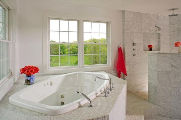 A luxury bathroom including a huge shower and Jacq