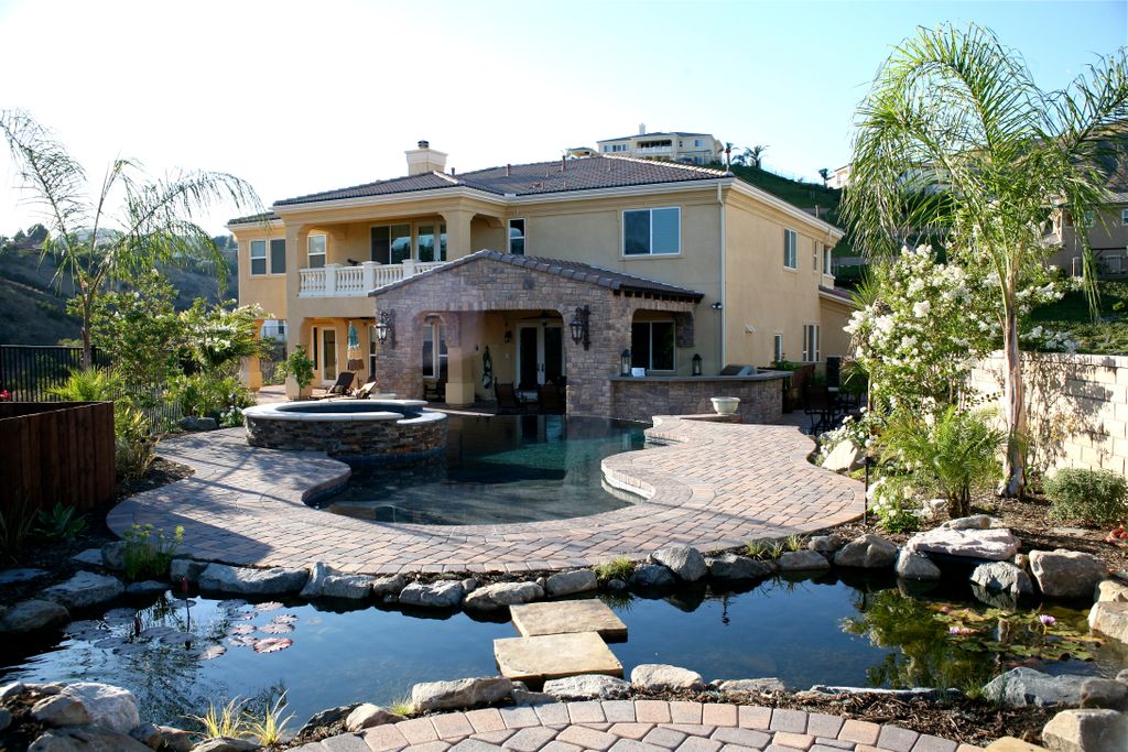 Complete landscape featuring pavilion, infinity ed