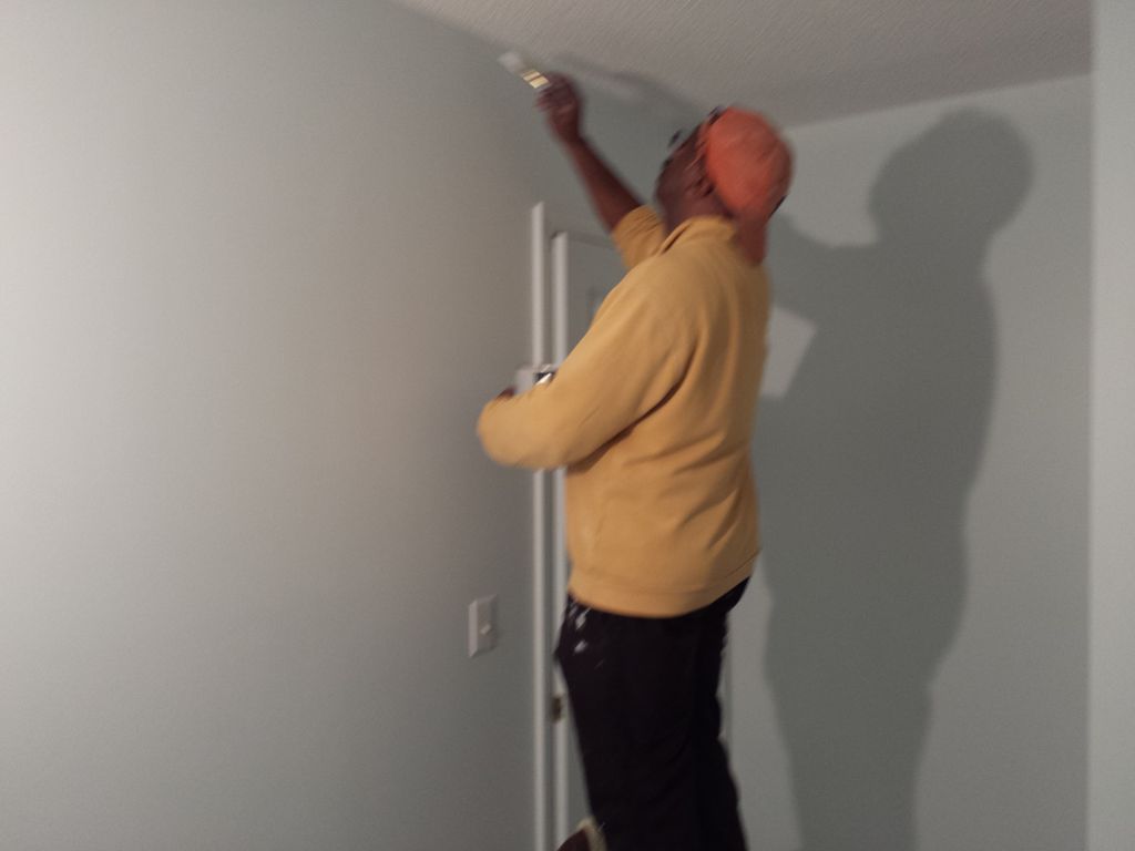 Trimming of ceiling after painting walls. In this 