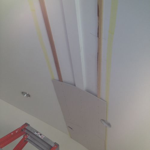 Existing beam covering with 1/4 drywall.