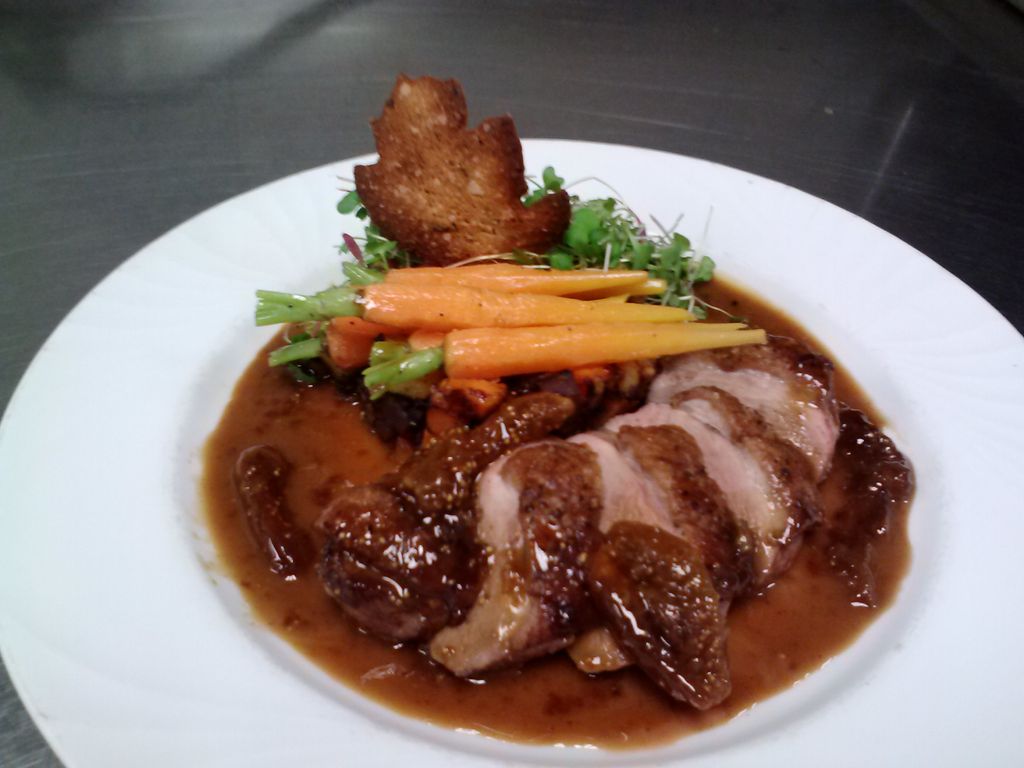 Pan seared duck breast, potato hash, baby carrots,