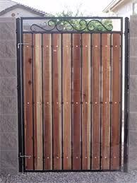 Single wrought iron gate refinished with cedar  wo