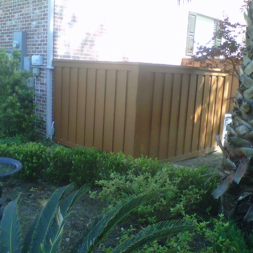 custom fence around pool filter and storage contai