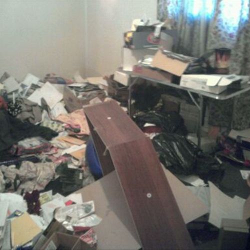 Before picture of one room in a "hoarder house we 