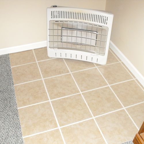 Vent free space heater on new tile, wall paint, an