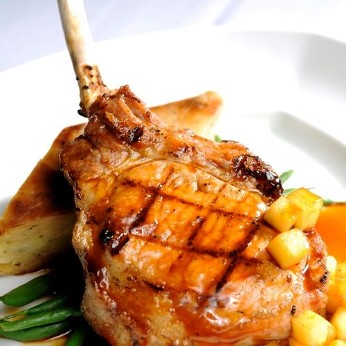 Grilled Pork chops with Dauphine potato, roasted g