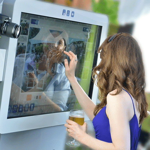 Brides maid having fun with the touchscreen monito