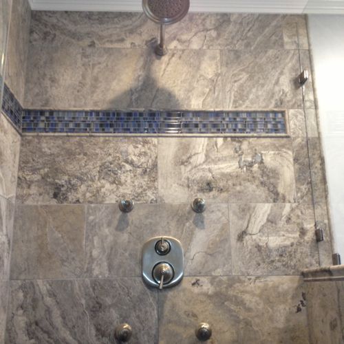 Spa shower with travertine tile