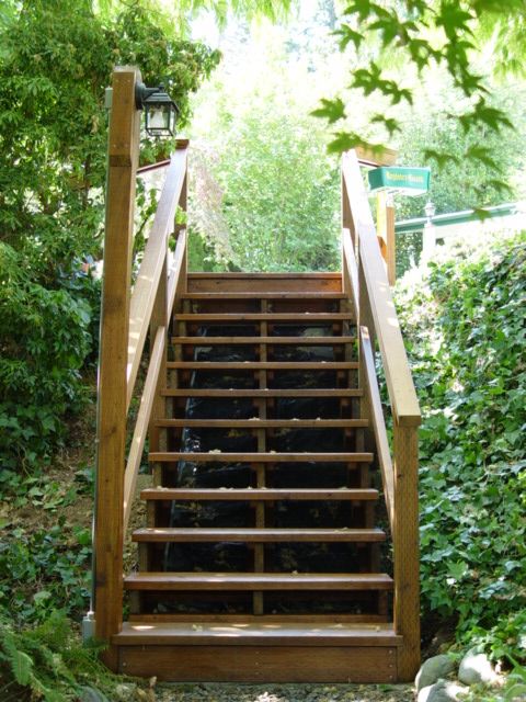 Cedar landing and stairs from street down to grave
