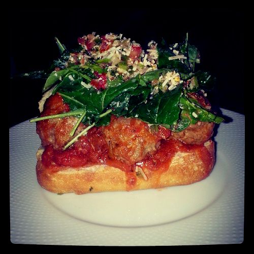 meatball sub with baby kale and spicy salso