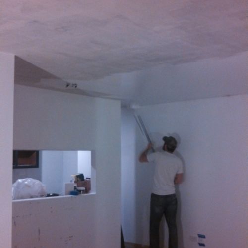 Removed popcorn ceiling and refinished.