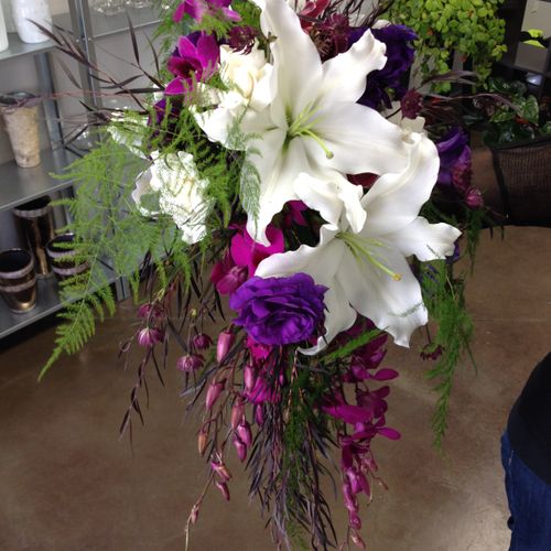 A cascading bridal bouquet featuring two types of 