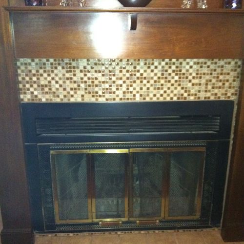Installed Fireplace Mantle and Mosaic Tile.