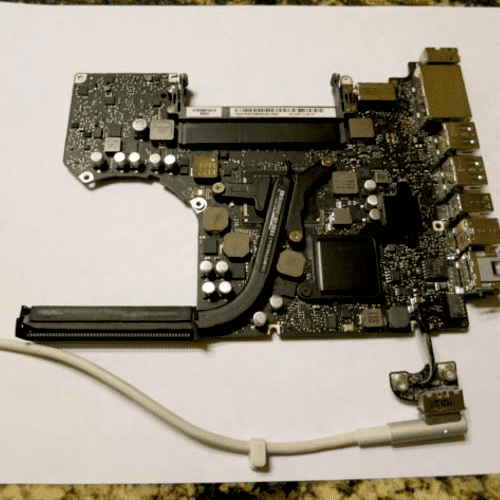 MacBook Pro logic board removed, cleaned using non