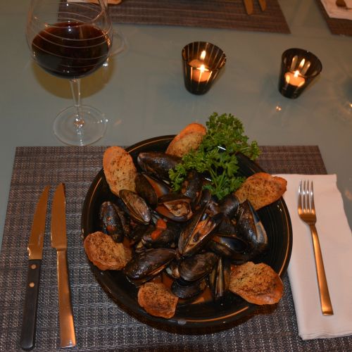 Mussels Marinara with herbed crostini for dipping.