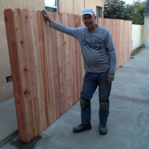 Steve The Proud Handyman in front of his newly bui