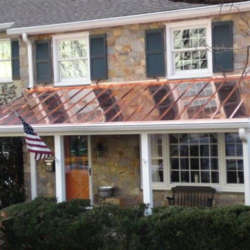Custom seamless gutters and beautiful copper panel