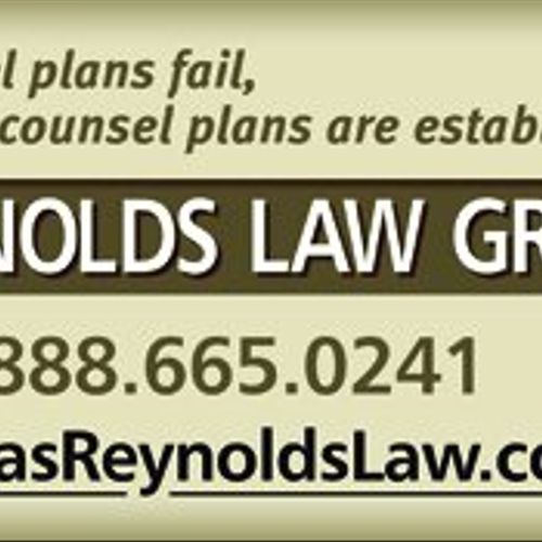 Reynolds Law Group Billboard visible in the City o