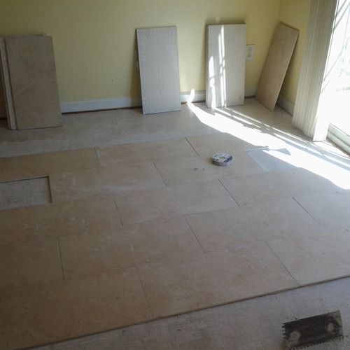Continued installing ceramic tile in dining room a