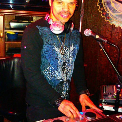 DJ Vince hosting karaoke at a local club.