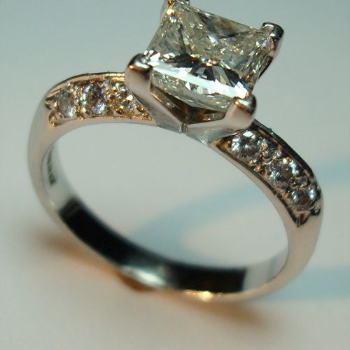 Custom platinum and diamond engagement ring featur