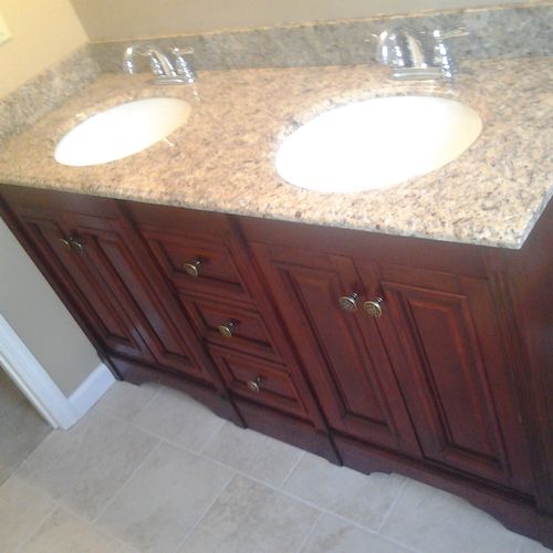 new vanity with granite top and delta valves