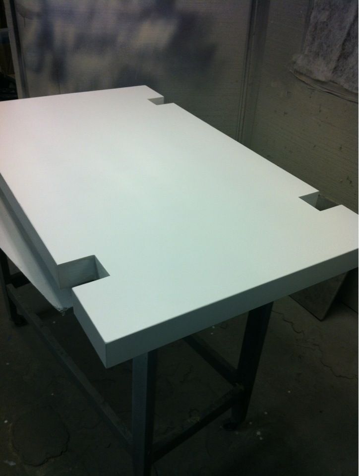 Spraying a coffee table.