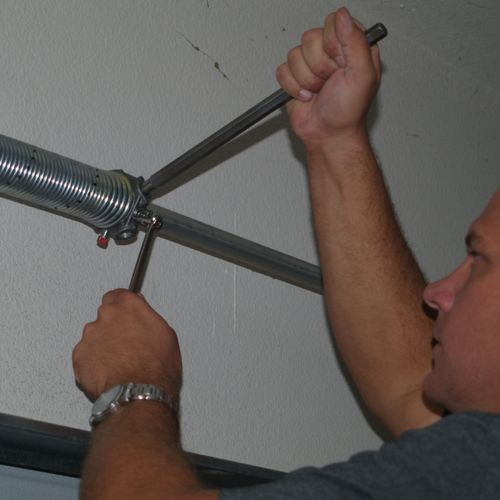 Repairing broken garage door springs- never attemp