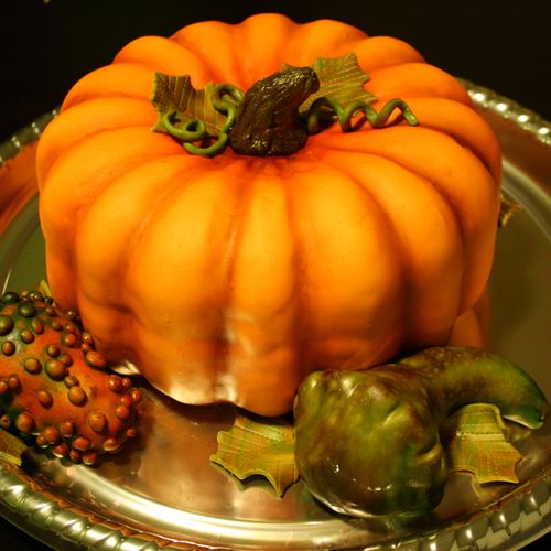 Fall themed pumpkin cake and gourds