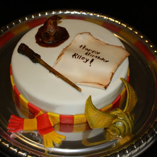 Harry Potter inspired cake with fondant hat, wand,