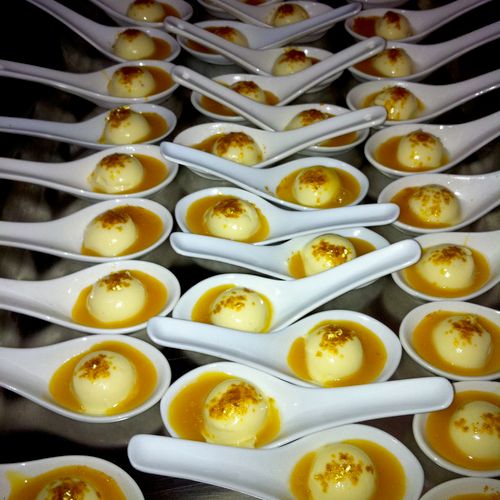 Mini vanilla bean Pannacotta's , mango coulis & go