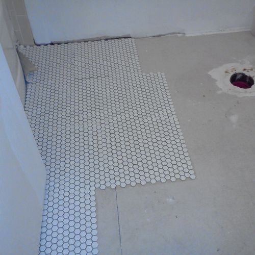 installing tile on a bathroom floor