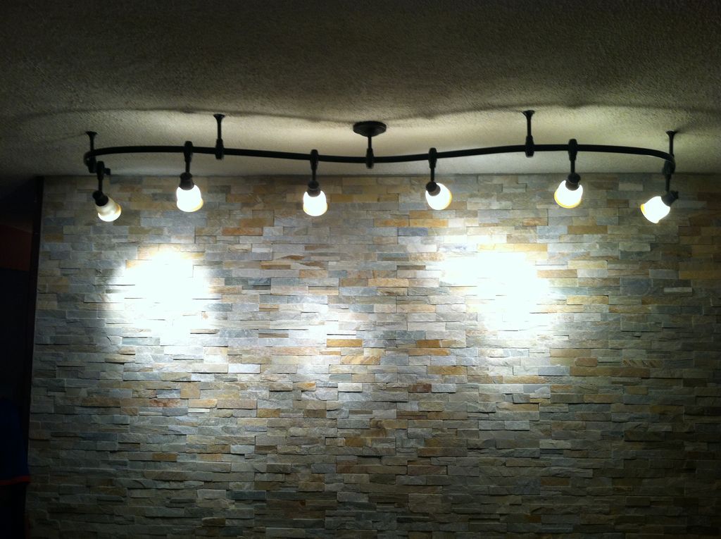 Track lighting with flexible track to bring out th